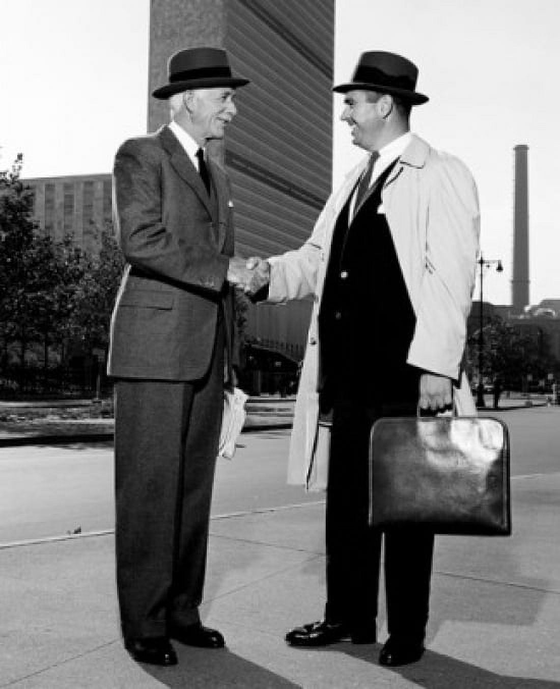 Businessmen shaking hands in downtown Canvas Art - (24 x 36)