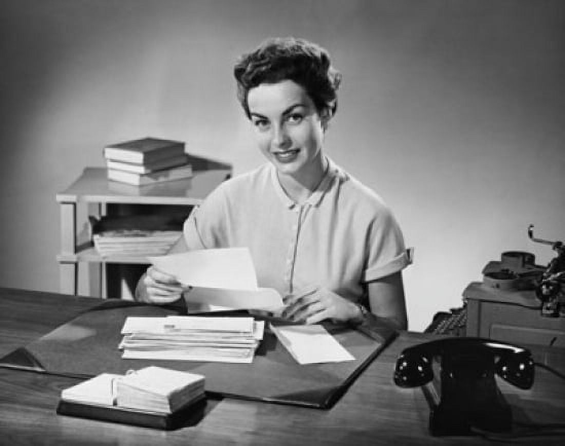 Businesswoman holding a document and smiling Canvas Art - (24 x 36)