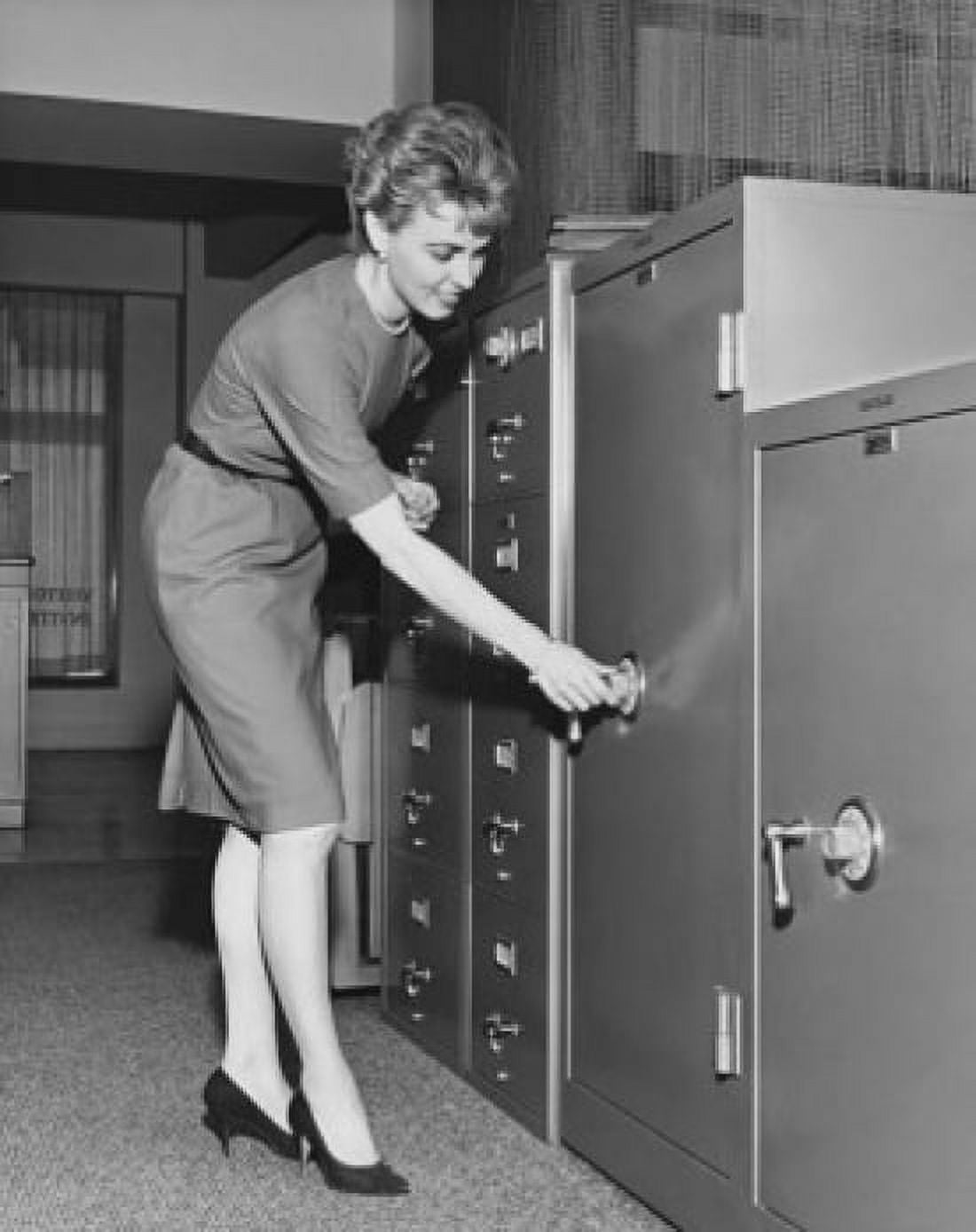 Businesswoman opening a combination lock Canvas Art - (18 x 24)