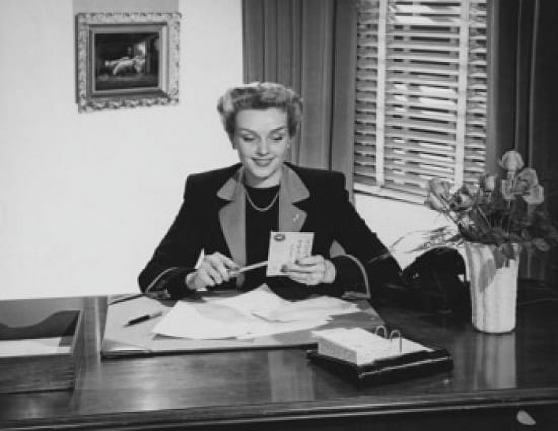 Businesswoman opening mail in an office Canvas Art - (18 x 24)