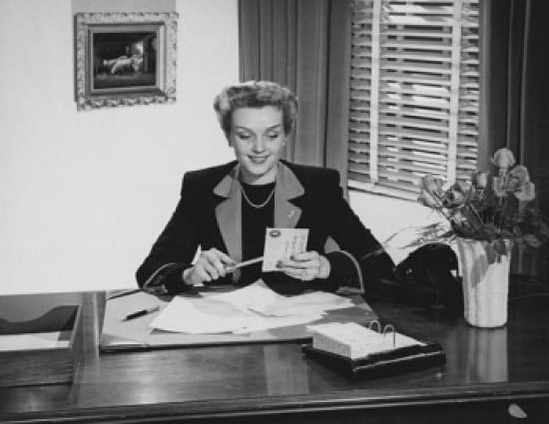 Businesswoman opening mail in an office Canvas Art - (24 x 36)