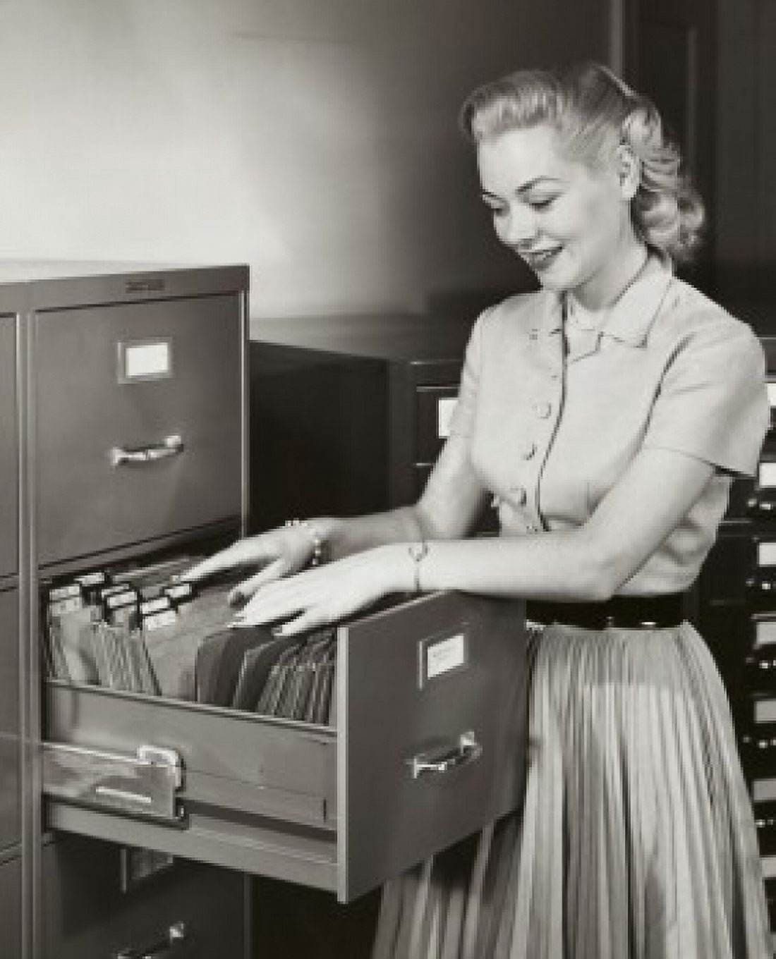 Businesswoman searching for files in a filing cabinet Canvas Art - (18 x 24)