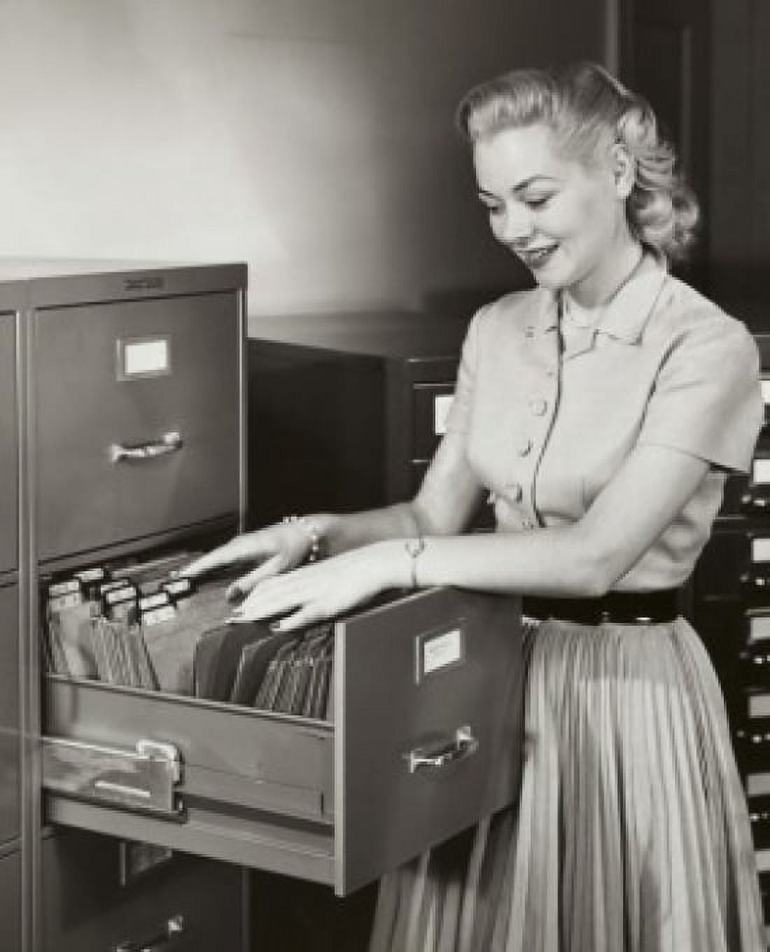 Businesswoman searching for files in a filing cabinet Canvas Art - (24 x 36)