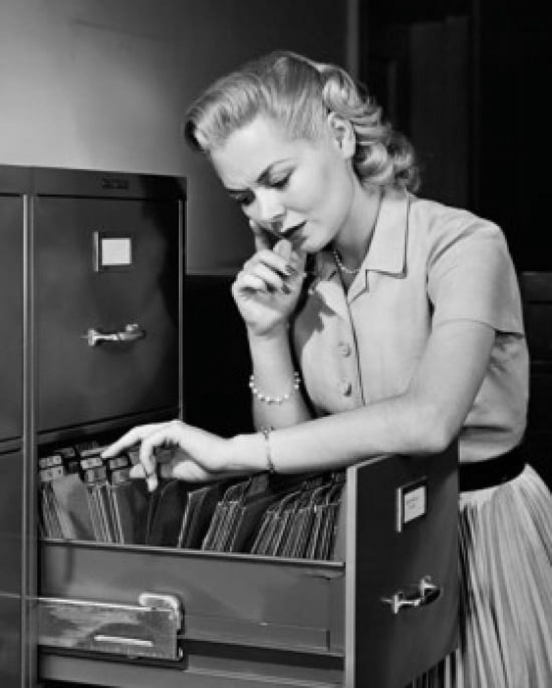 Businesswoman searching for files in a filing cabinet Canvas Art - (24 x 36)