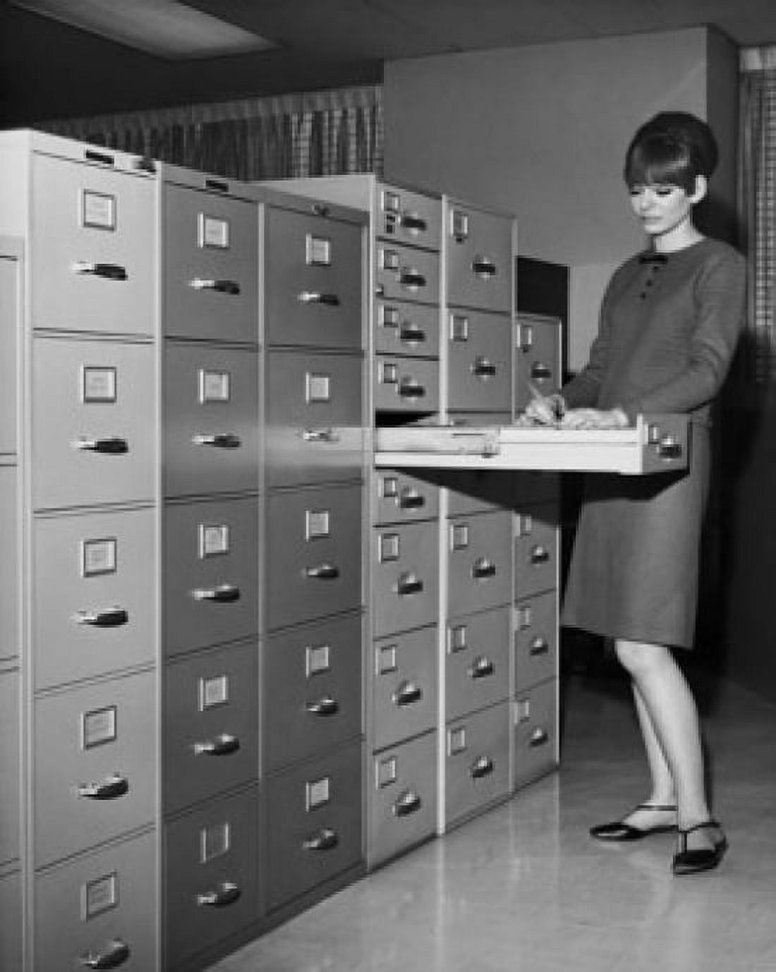Businesswoman searching for files in filing cabinet Canvas Art - (24 x 36)