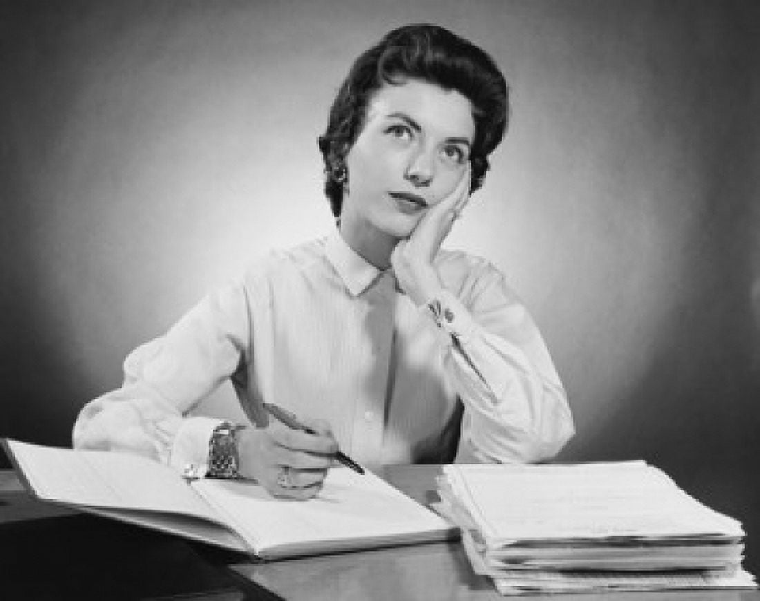 Businesswoman sitting at a desk and thinking in an office Canvas Art - (18 x 24)