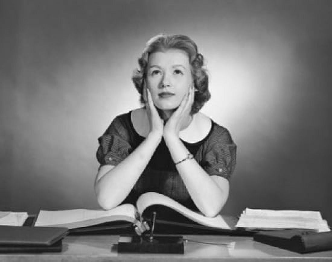 Businesswoman sitting at a desk and thinking in an office Canvas Art - (18 x 24)