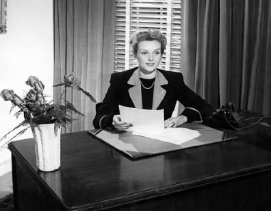 Businesswoman sitting in an office Canvas Art - (18 x 24)