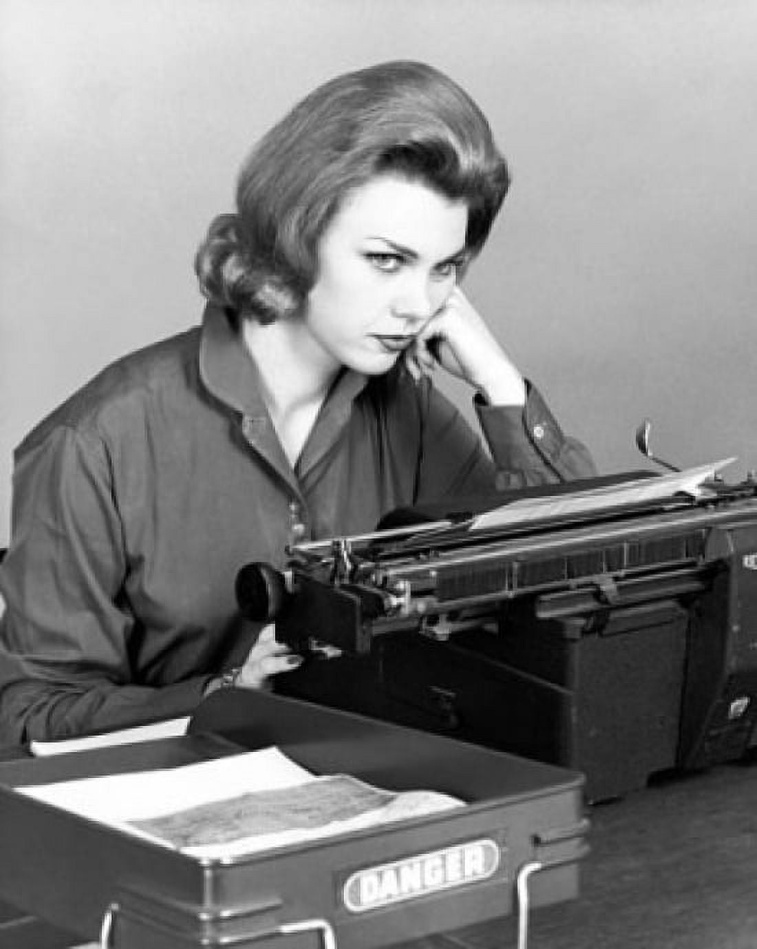 Businesswoman sitting in front of a typewriter and thinking Canvas Art - (24 x 36)