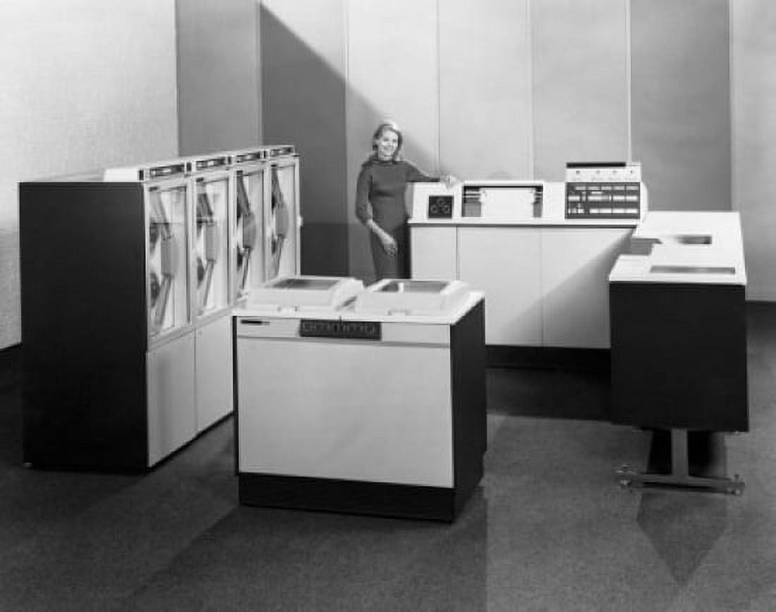Businesswoman standing near a data processing system 1968 Canvas Art - (24 x 36)