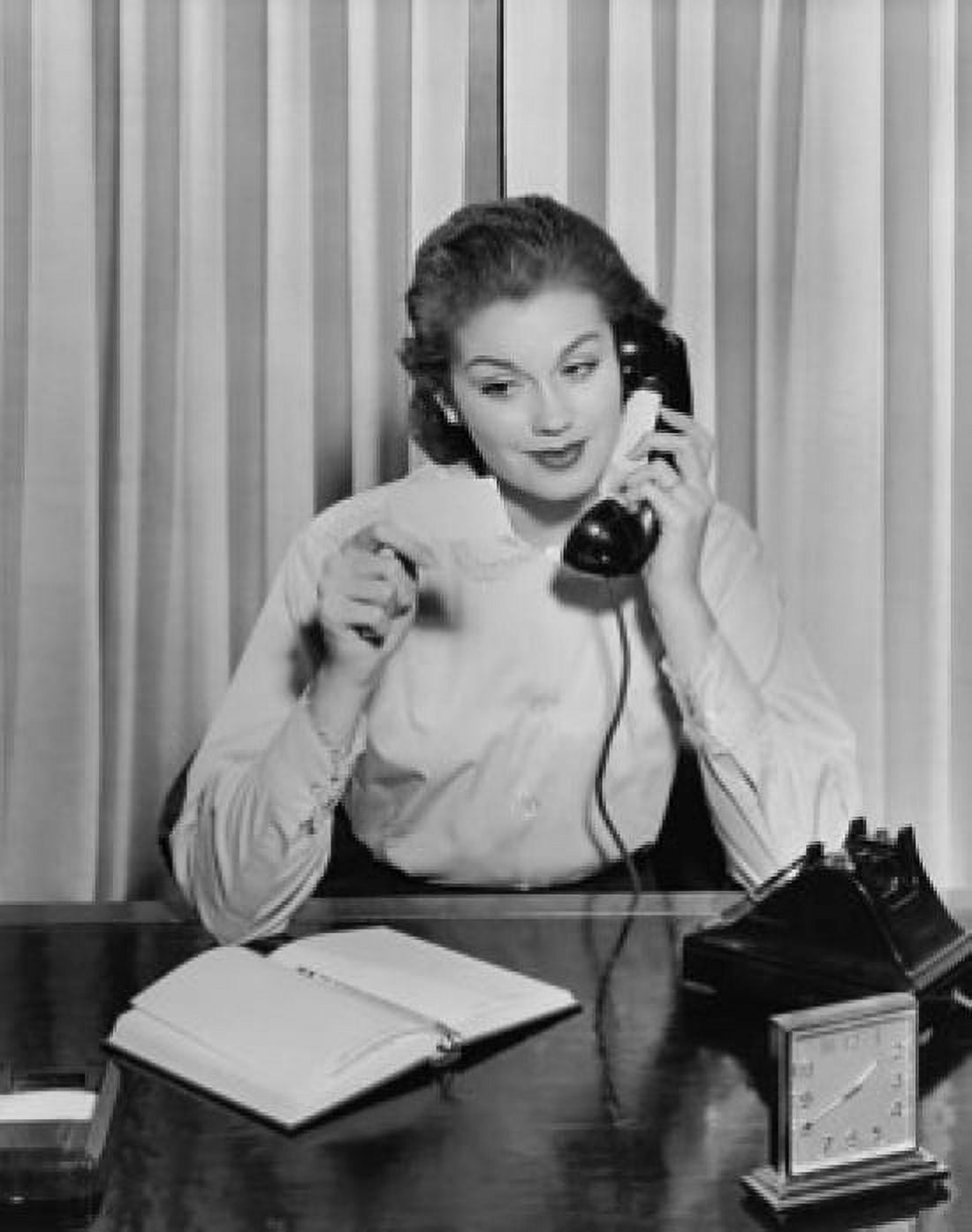Businesswoman talking on the telephone and holding a bill Canvas Art - (24 x 36)