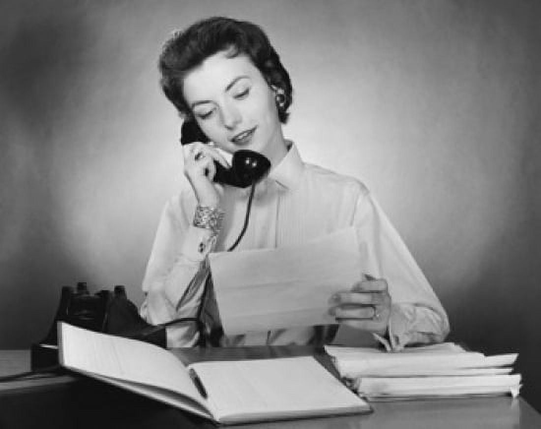 Businesswoman talking on the telephone and holding a document in an office Canvas Art - (24 x 36)