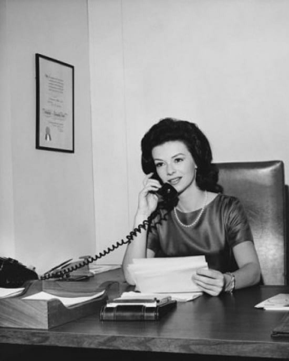 Businesswoman talking on the telephone in an office Canvas Art - (18 x 24)
