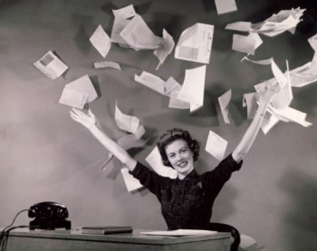 Businesswoman throwing papers in office Canvas Art - (24 x 36)