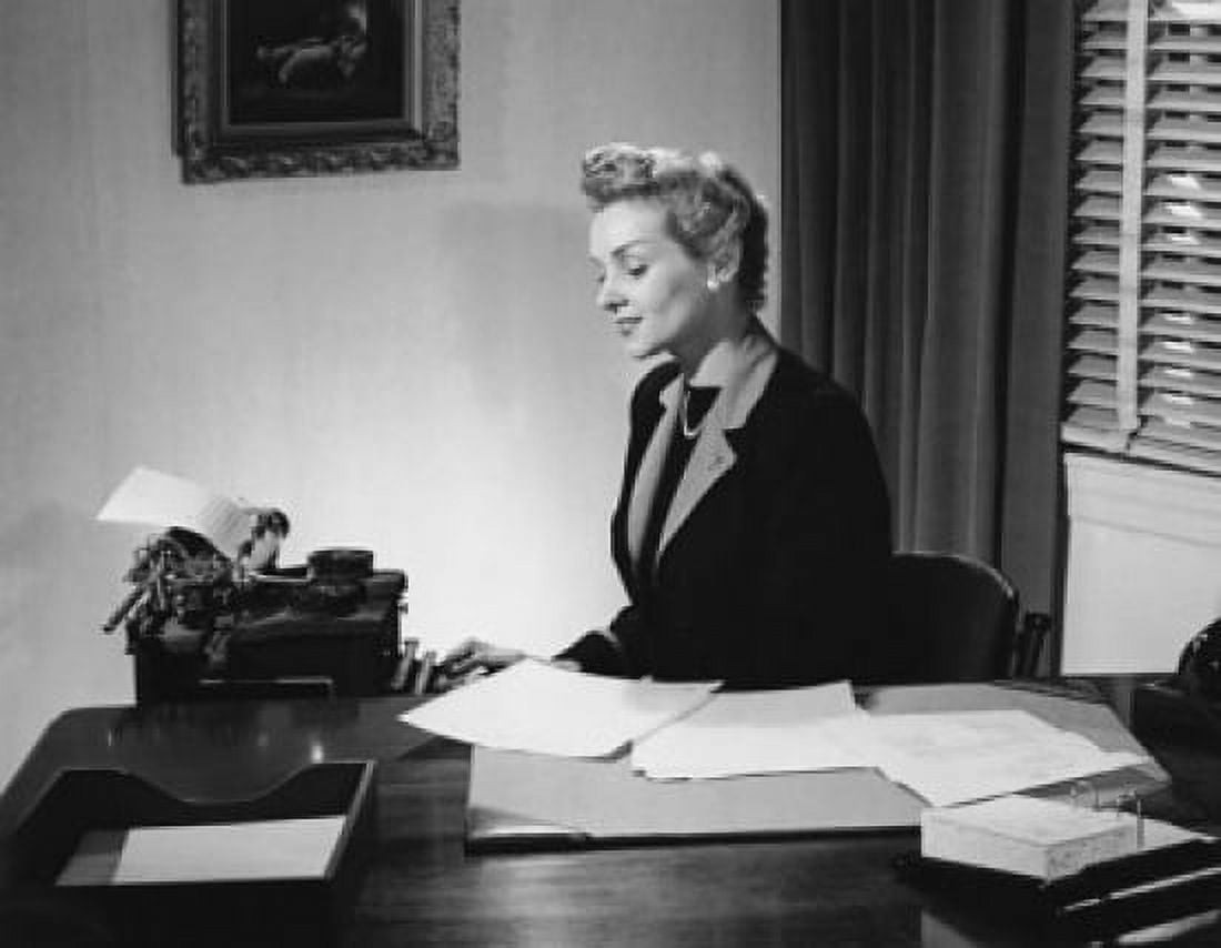 Businesswoman typing on a typewriter in an office Canvas Art - (24 x 36)