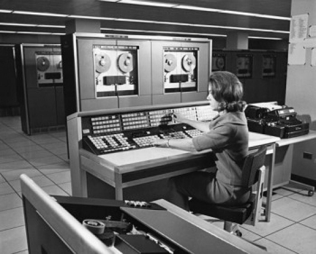 Businesswoman working on a mainframe computer in an office Canvas Art - (24 x 36)
