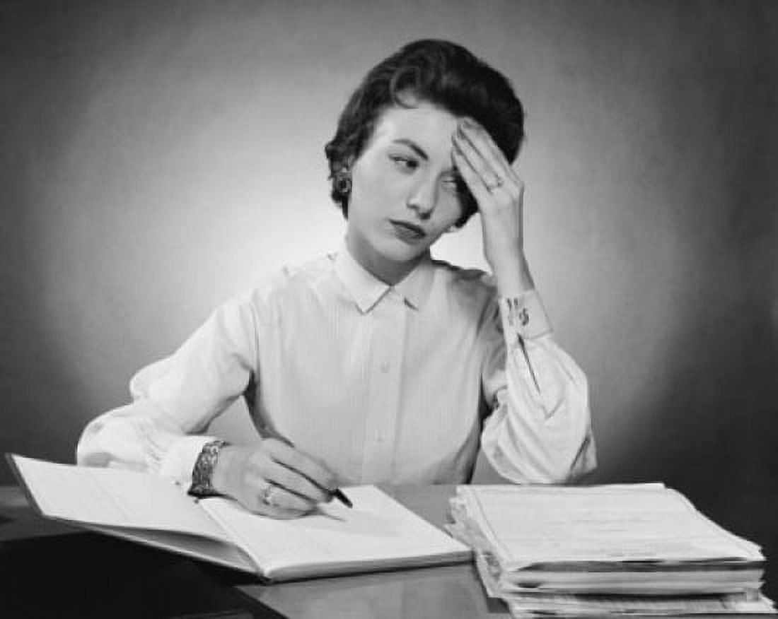 Businesswoman writing in a notebook in an office Canvas Art - (18 x 24)