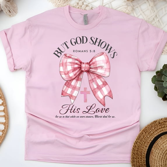 But God Shows His Love T-Shirt, Romans 5:8 Bible Verse Tee with Pink Bow, Light Pink, Size M