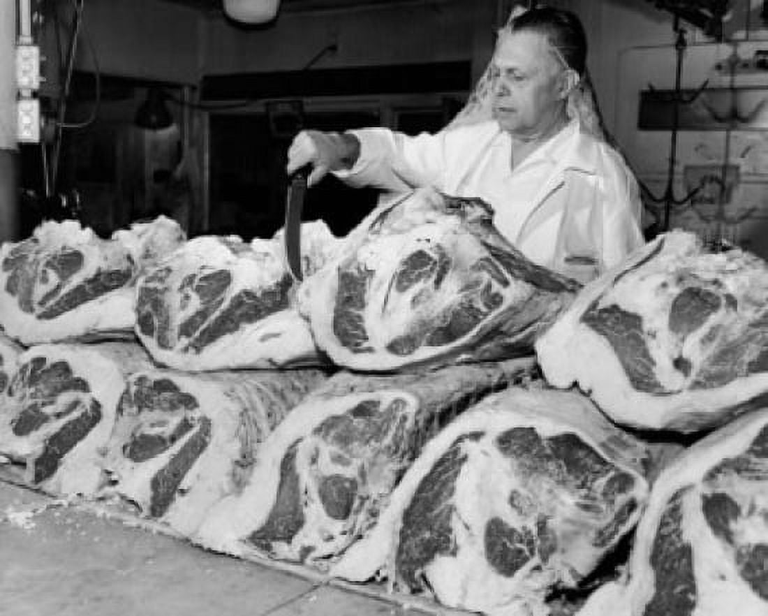 Butcher inspecting beef at a butchers shop Canvas Art - (18 x 24)