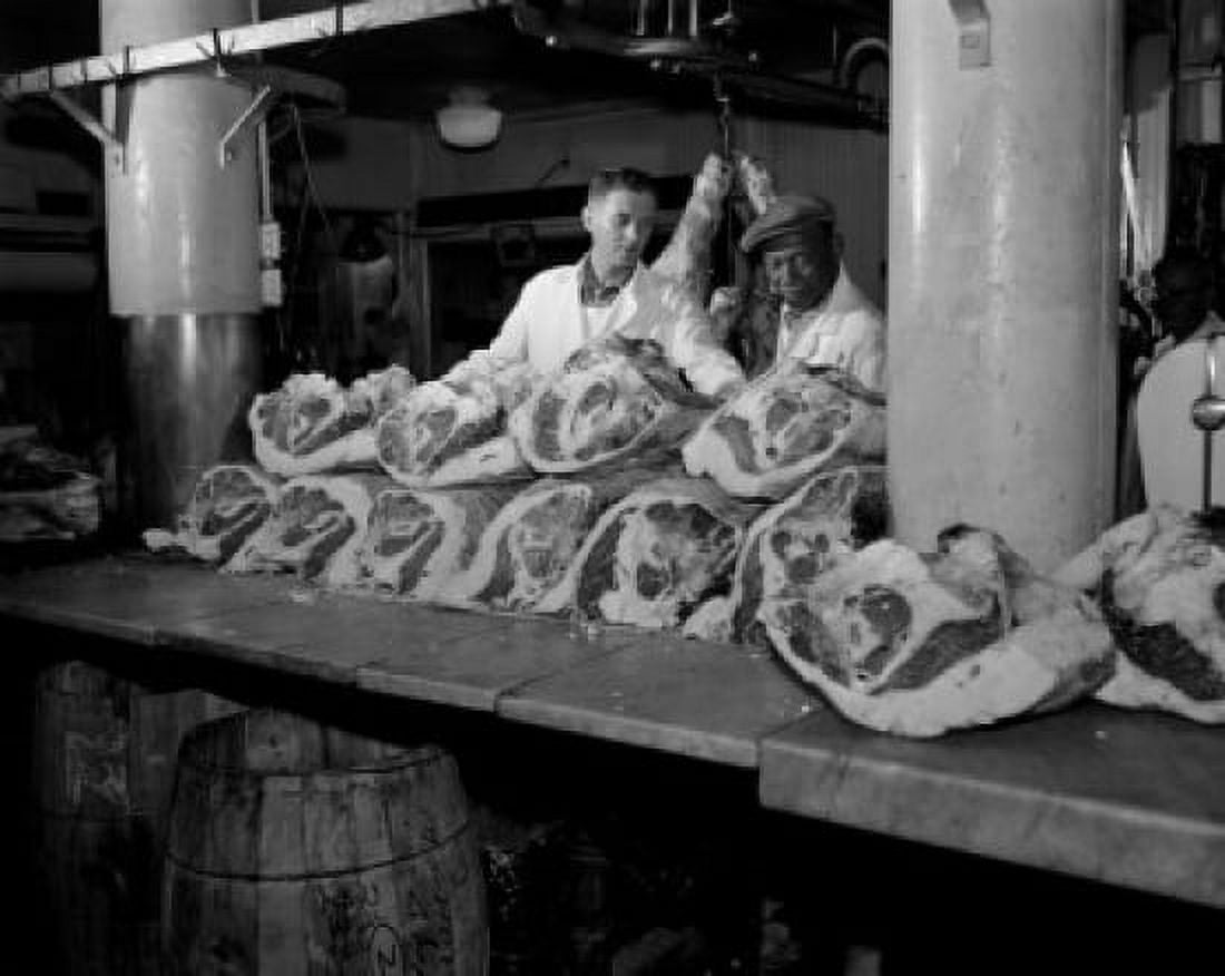 Butcher inspecting beef at butchers shop Canvas Art - (18 x 24)