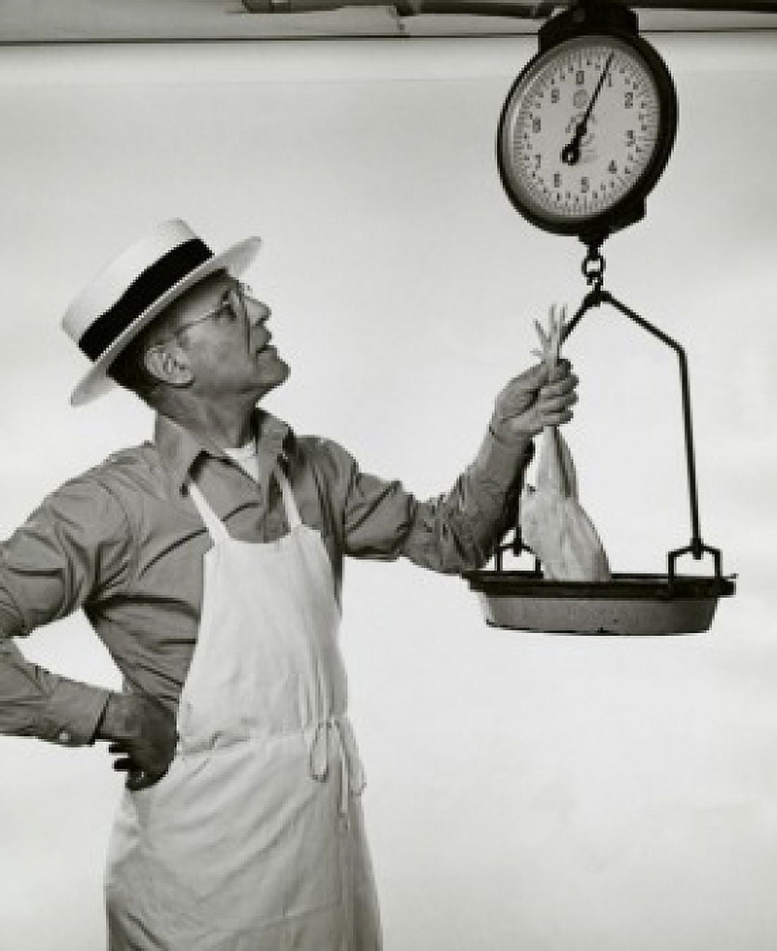 Butcher weighing a chicken Canvas Art - (18 x 24)