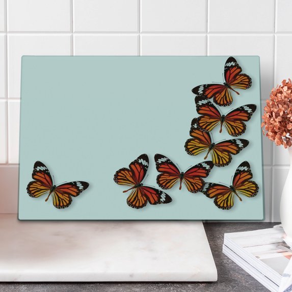 Butterflies Cutting Board, Monarch Butterfly Flying Frame Insect Exotic Weather, Decorative Tempered Glass Cutting and Serving Board, Large Size, Dark Brown Marigold, by Ambesonne
