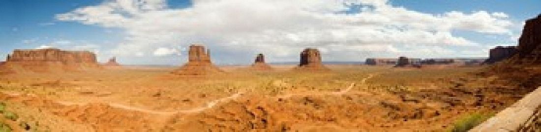 Buttes in a desert The Mittens Monument Valley Tribal Park Monument Valley Utah USA Canvas Art - Panoramic Images (20 x 5)