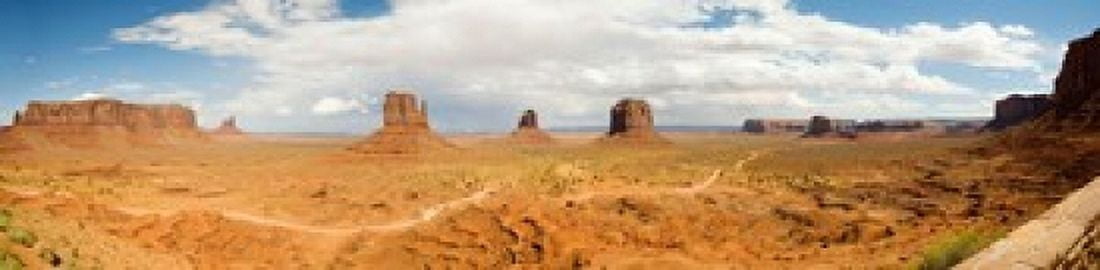 Buttes in a desert The Mittens Monument Valley Tribal Park Monument Valley Utah USA Canvas Art - Panoramic Images (40 x 10)