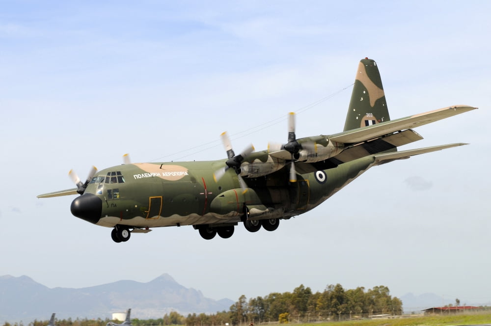 C-130 Hercules from the Hellenic Air Force landing at Decimomannu Air Base Italy Canvas Art - Riccardo NiccoliStocktrek Images (17 x 12)