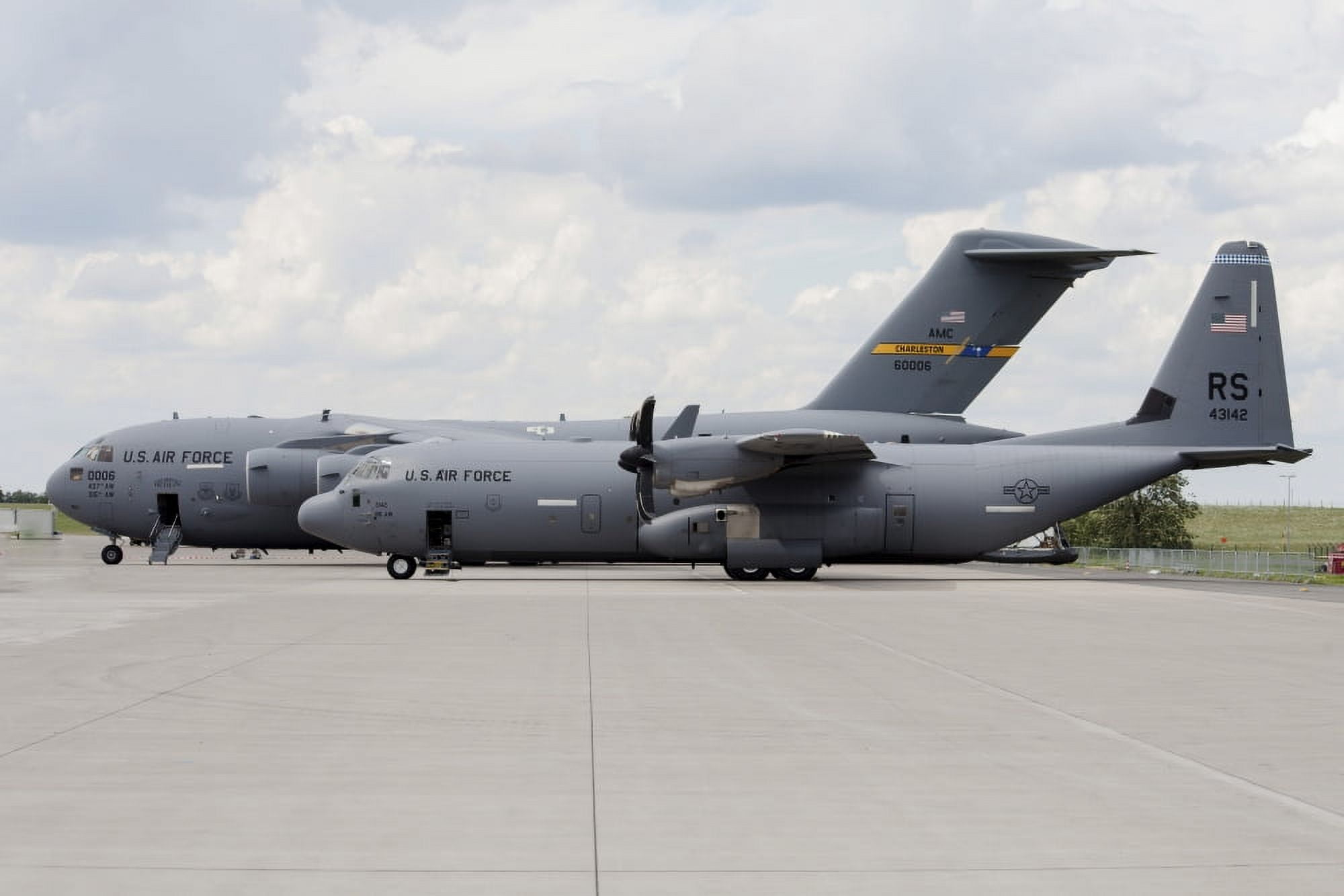 C-130J Super Hercules with a C-17 Globemaster Canvas Art - Timm ZiegenthalerStocktrek Images (18 x 12)