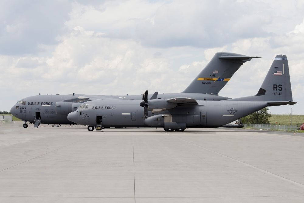C-130J Super Hercules with a C-17 Globemaster Canvas Art - Timm ZiegenthalerStocktrek Images (35 x 24)