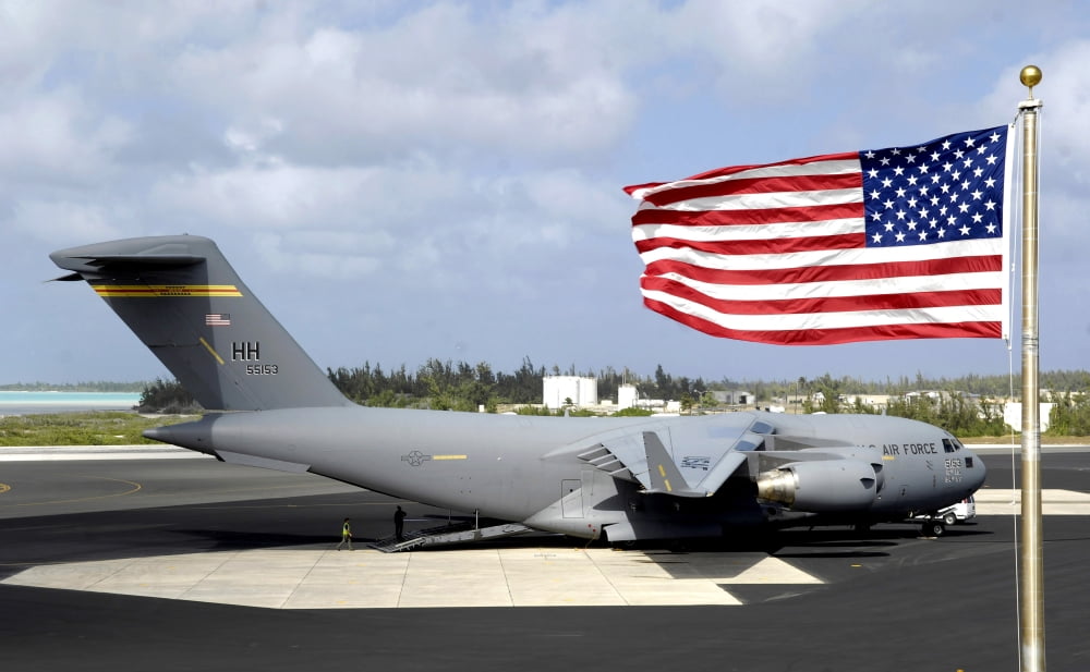 C-17 Globemaster III sits on the flightline at Wake Island Canvas Art - Stocktrek Images (35 x 22)