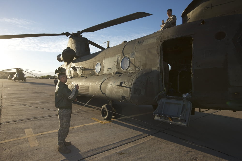 CH-47 Chinook crew preparing to load up for their mission Canvas Art - Terry MooreStocktrek Images (35 x 23)