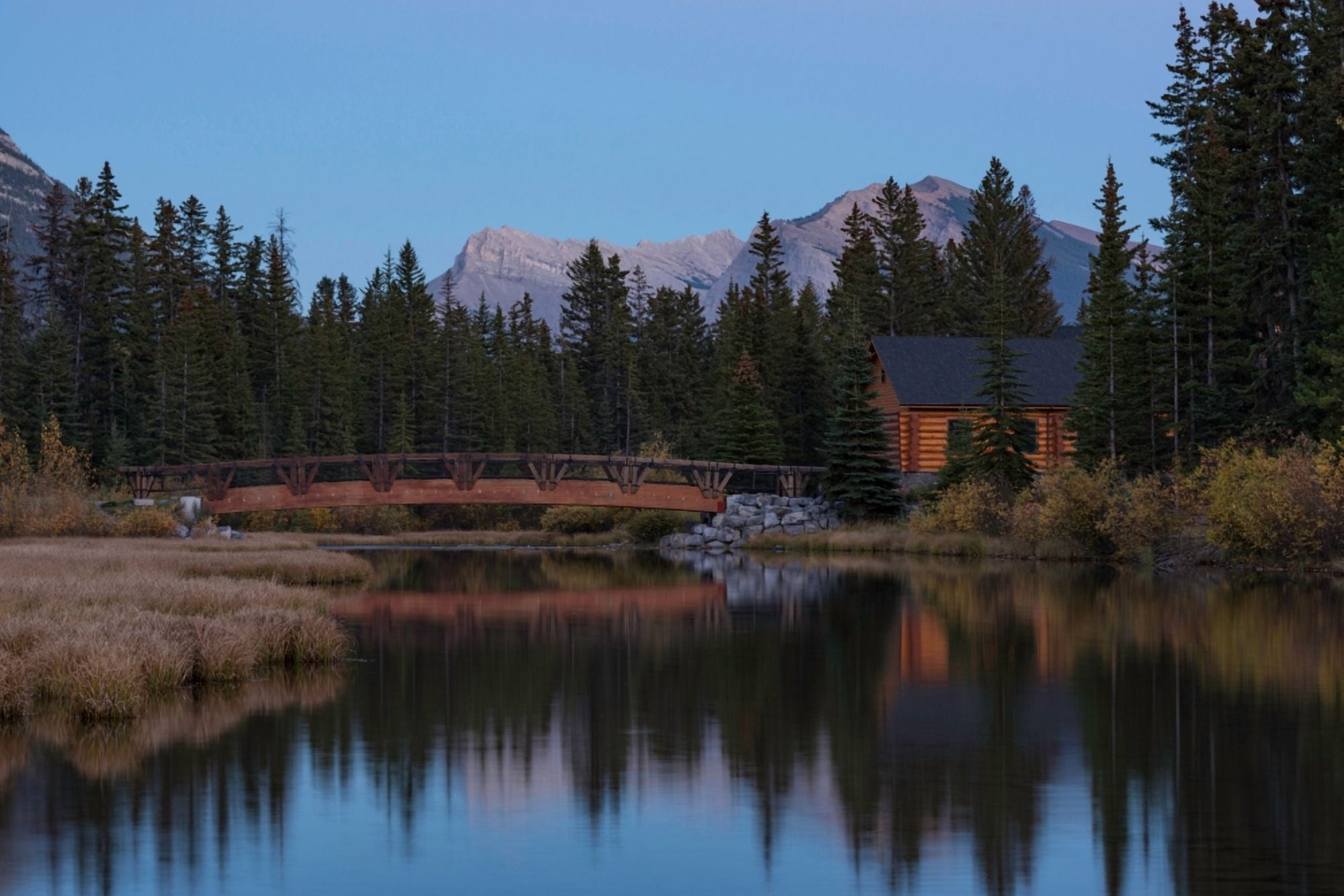 Cabin and bridge on Policemans Creek Pigeon Mountain Mt McGillivray Canmore Alberta Canada Canvas Art - Panoramic Images (24 x 36)