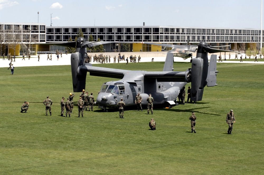 Cadets and active-duty troops swarm around a CV-22 Osprey Canvas Art - Stocktrek Images (34 x 23)
