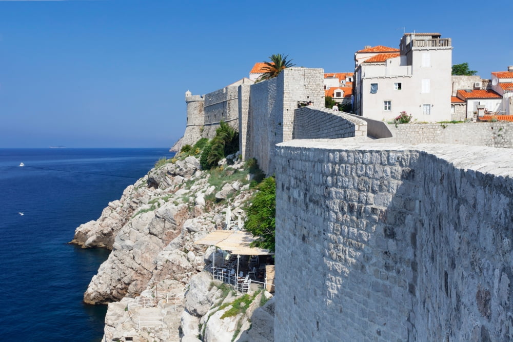 Cafe below the city wall at old town of Dubrovnik Dalmatia Croatia Canvas Art - Panoramic Images (36 x 12)