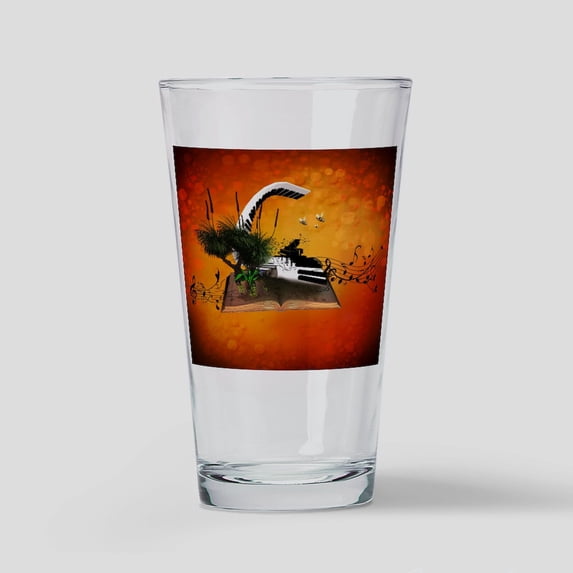 CafePress - A Piano Is Flying Out Of A Book. - Pint Glass, Drinking Glass, 16 oz. CafePress