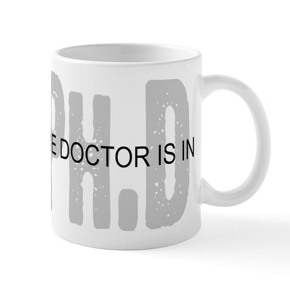 CafePress - Phd The Doctor Is In Mugs - 11 oz Ceramic Mug - Novelty Coffee Tea Cup