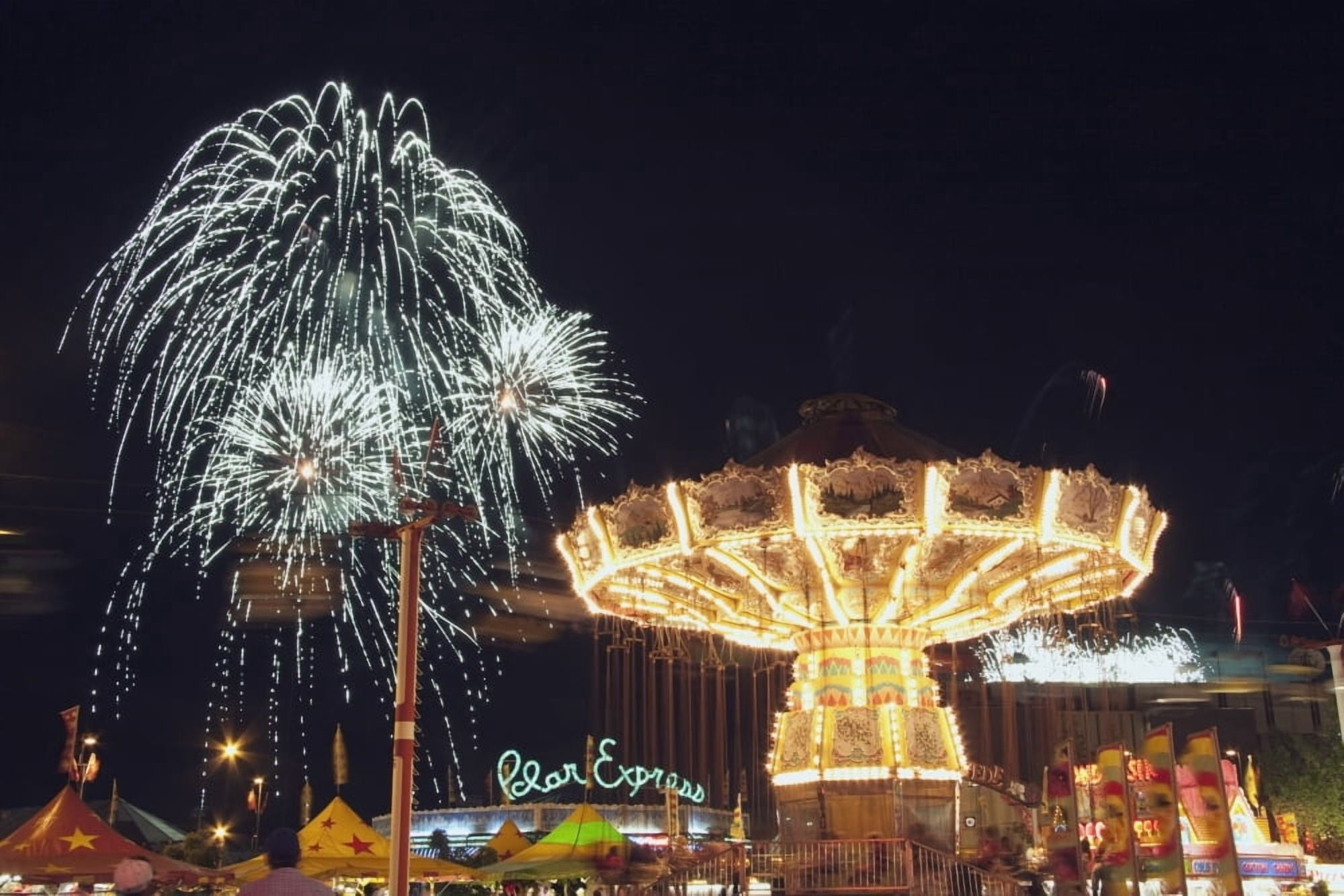 Calgary Alberta Canada Midway Rides At Night With Fireworks At The Calgary Stampede Canvas Art - Michael Interisano Design Pics (19 x 12)