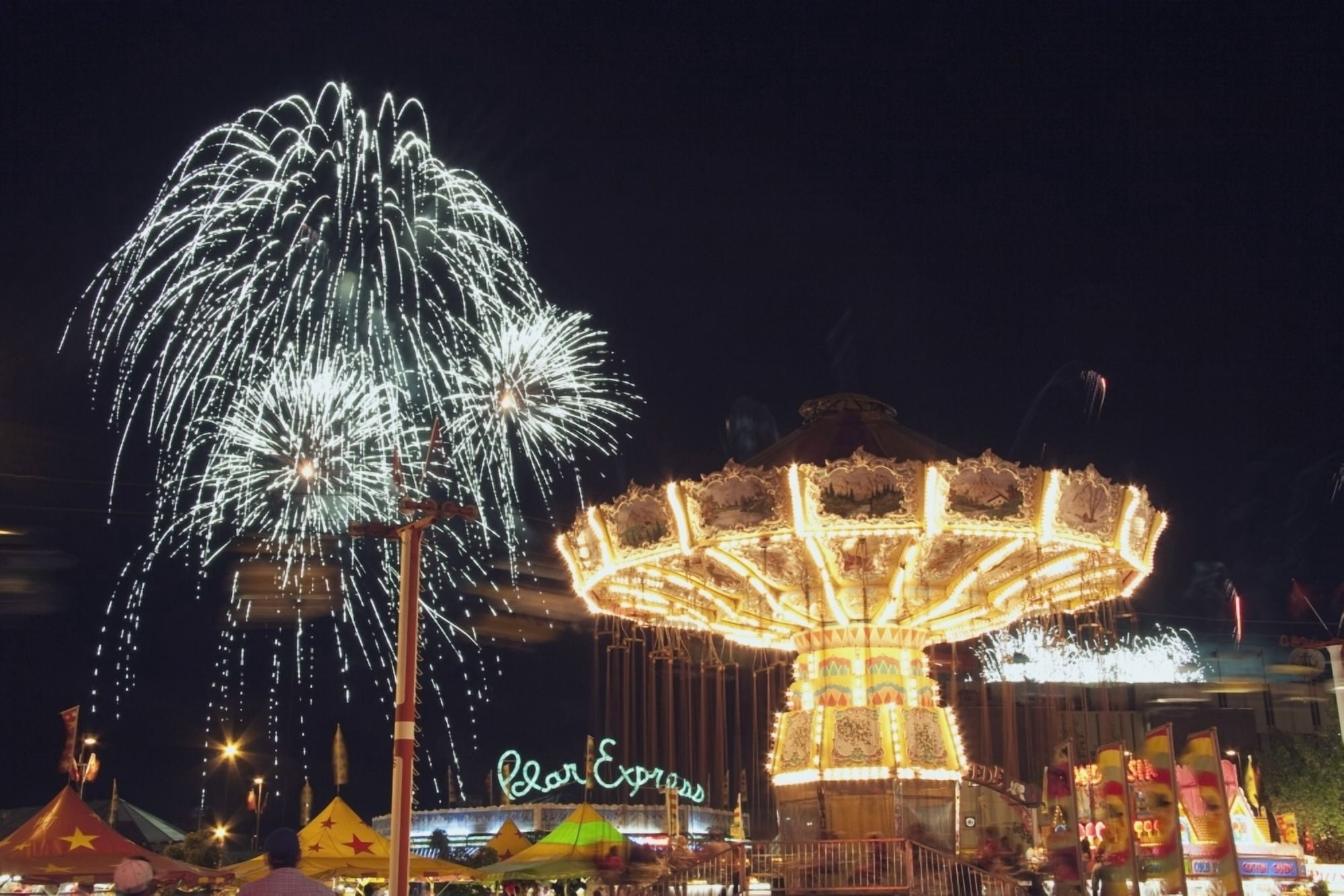 Calgary Alberta Canada Midway Rides At Night With Fireworks At The Calgary Stampede Canvas Art - Michael Interisano Design Pics (38 x 24)
