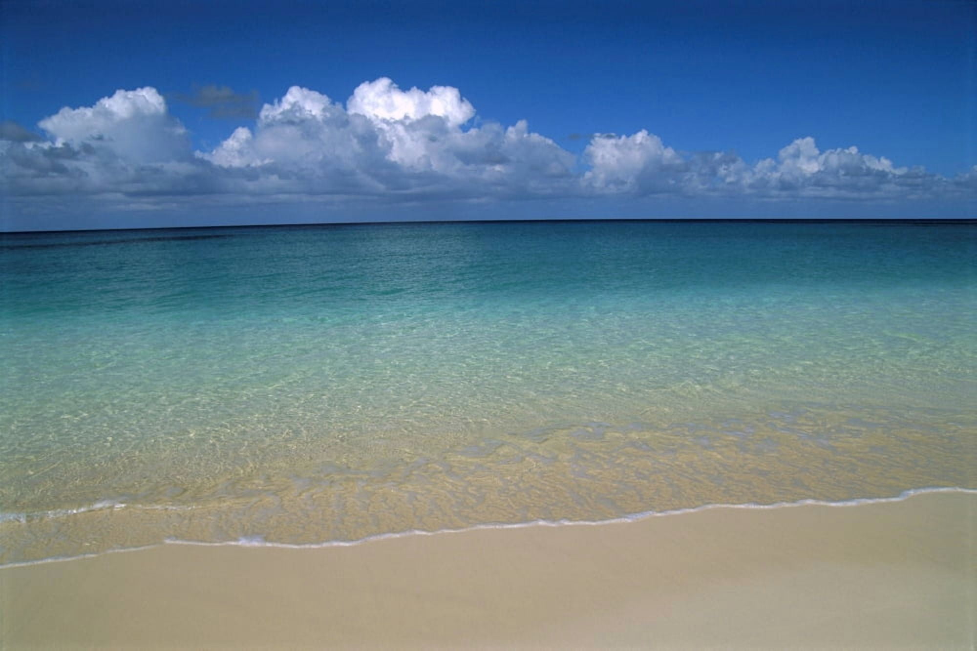 Calm Shoreline Water With Many Different Shades Of Blue Clouds Above Horizon Canvas Art - Greg Vaughn Design Pics (19 x 12)