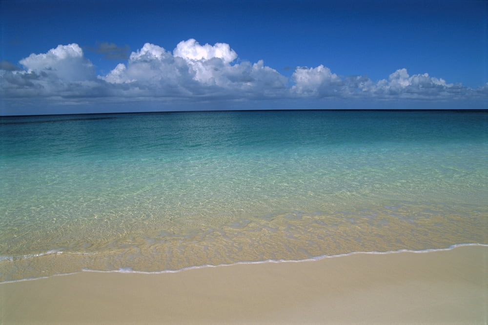 Calm Shoreline Water With Many Different Shades Of Blue Clouds Above Horizon Canvas Art - Greg Vaughn Design Pics (38 x 24)