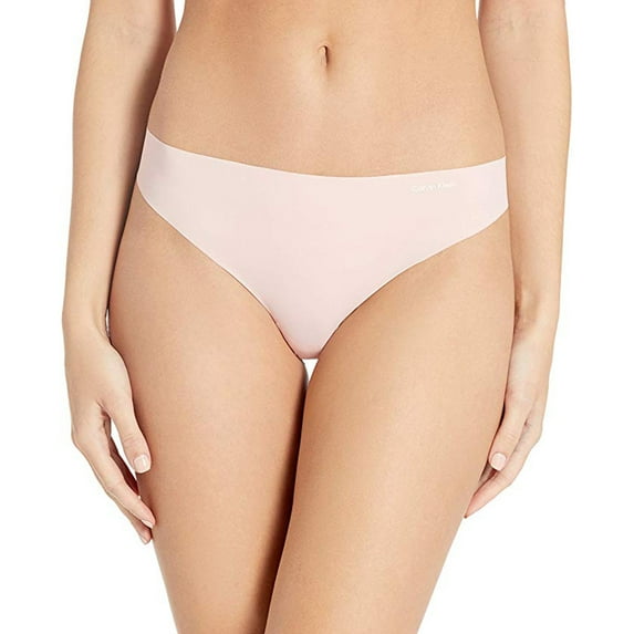 Calvin Klein Women's Invisibles Thong Panty, Peach Glow, M