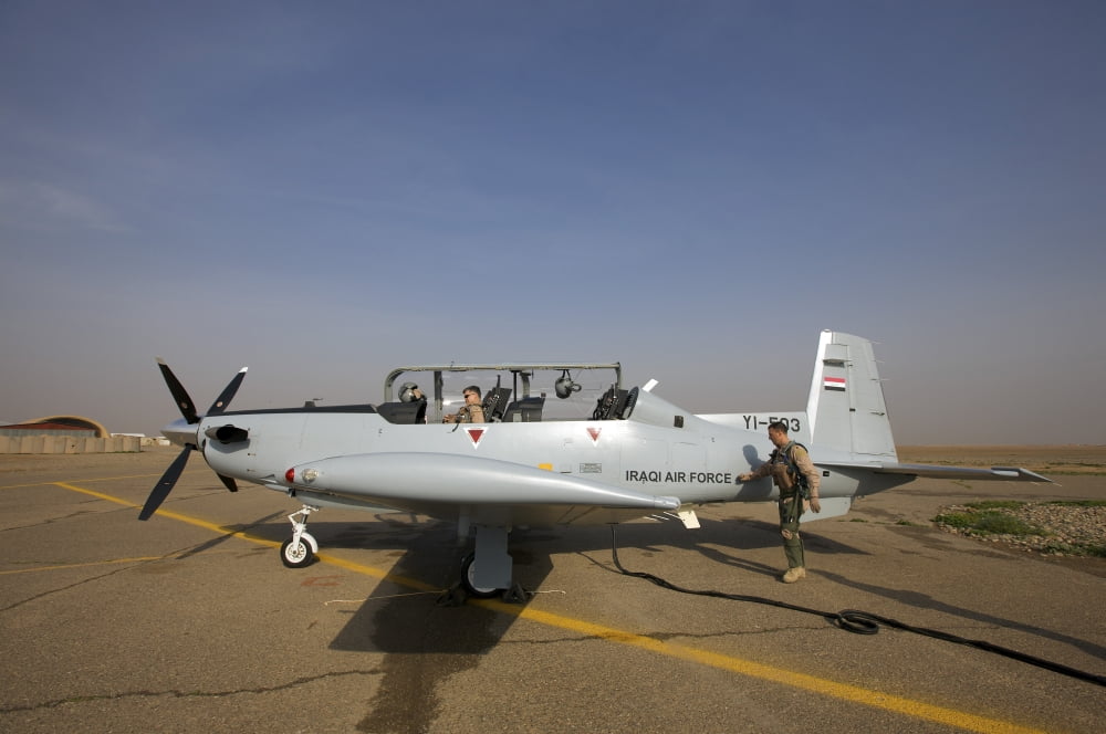 Camp Speicher Iraq - US Air Force pilots in an Iraqi Air Force T-6 Texan trainer aircraft Canvas Art - Terry MooreStocktrek Images (35 x 23)