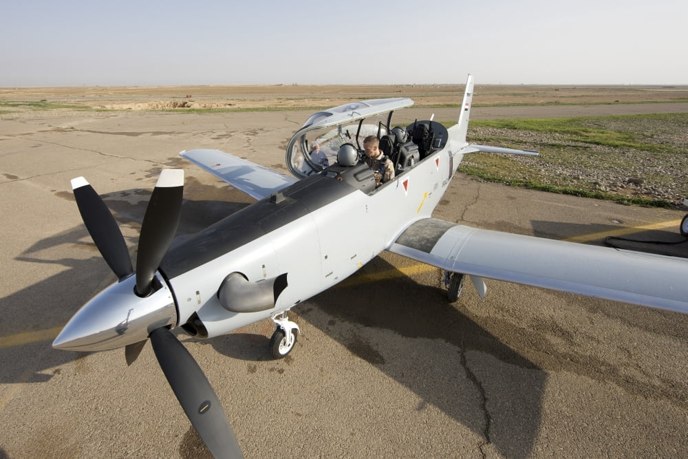 Camp Speicher Iraq - US Air Force pilots in an Iraqi Air Force T-6 Texan trainer aircraft Canvas Art - Terry MooreStocktrek Images (35 x 23)