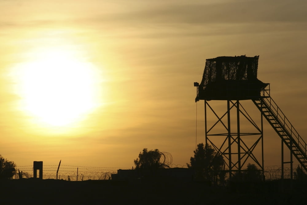 Camp Warhorse guard tower at sunset Canvas Art - Terry MooreStocktrek Images (17 x 12)