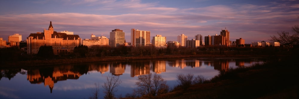 Canada Saskatchewan Saskatoon Buildings along a river Canvas Art - Panoramic Images (36 x 12)