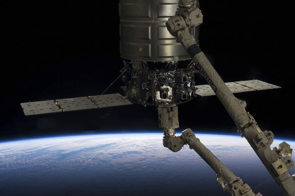 Canadarm2 robotic arm prepares to release the Cygnus spacecraft Canvas Art - Stocktrek Images (34 x 23)