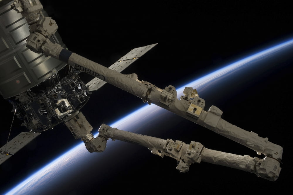 Canadarm2 robotic arm prepares to release the Cygnus spacecraft Canvas Art - Stocktrek Images (34 x 23)