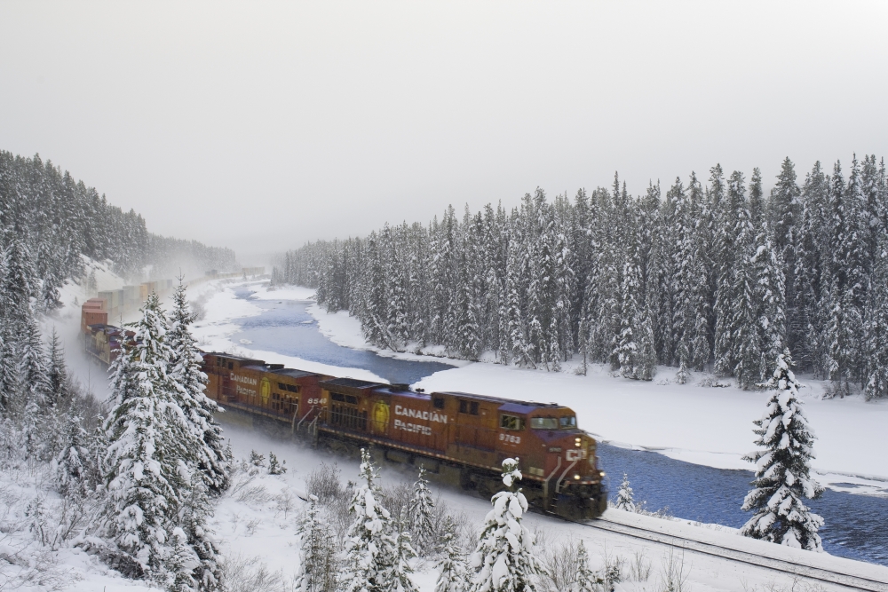 Canadian Pacific Train At Morants Curve Along The Bow River Banff National Park Alberta Canvas Art - Darwin Wiggett Design Pics (17 x 11)